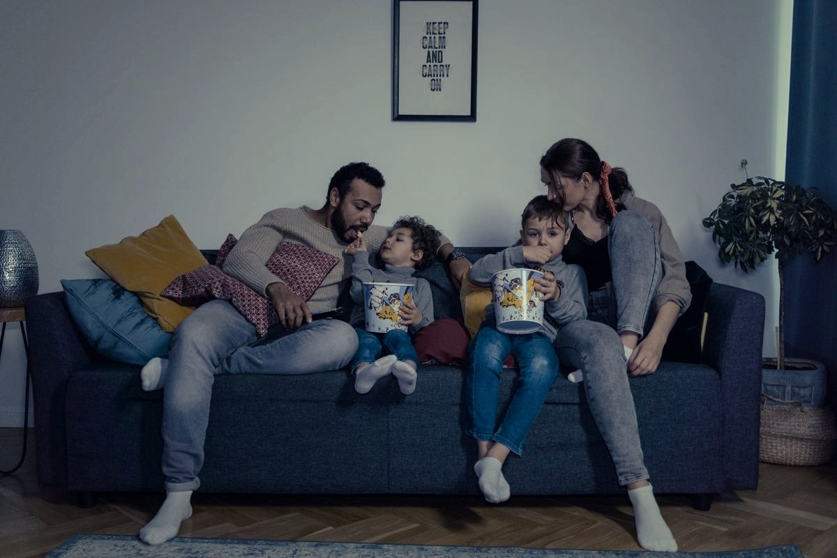 Family relaxing together on the sofa